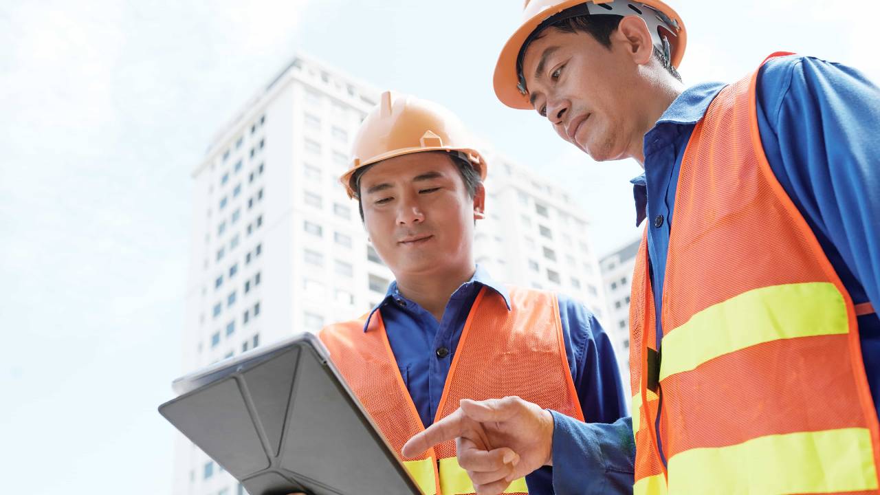 engineers analyzing data digital tablet